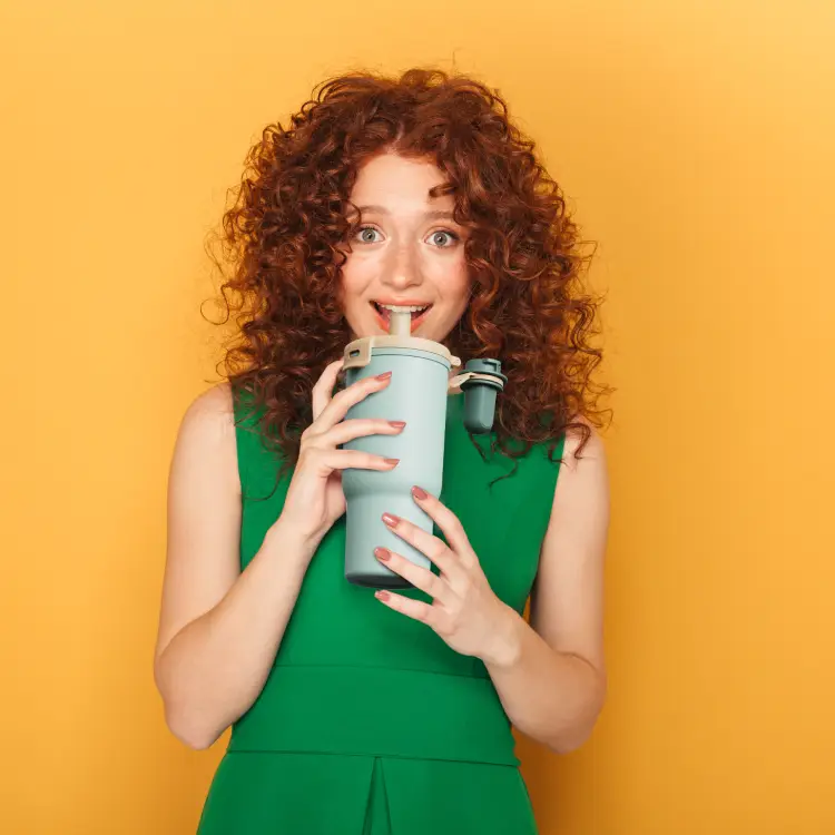 a woman holding a Insulated Mug